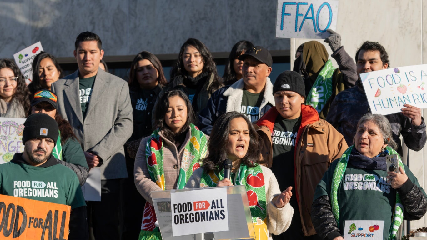 Andrea Williams, President of Oregon Food Bank, speaking with advocates gathered around
